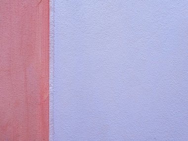 İki tonda boyanmış sert beton duvar yüzeyi turuncuya boyanmış..