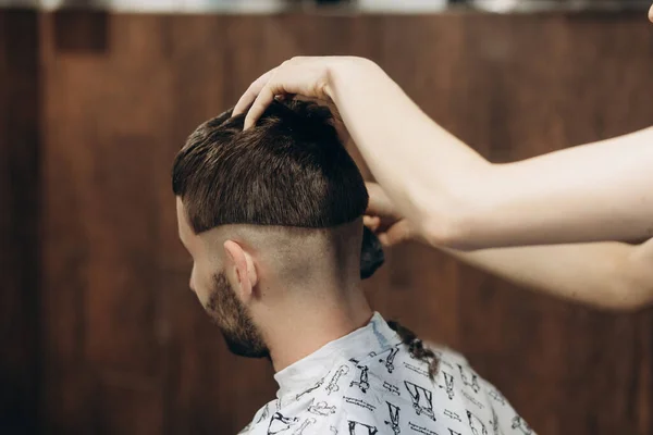 Hairdresser Cuts Bearded Young Guy Hair Trimmer Combing Hair His — Stock Photo, Image