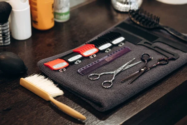 Professional barbering tools of hairdresser on table. Tools for cutting beard and hair barbershop.