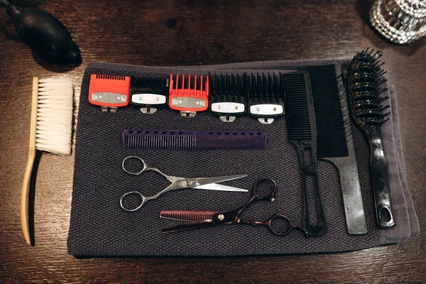 Professional barbering tools of hairdresser on table. Tools for cutting beard and hair barbershop.