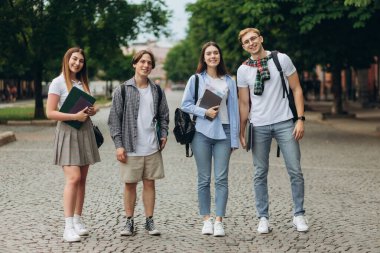 Group of teenage students standing outdoors