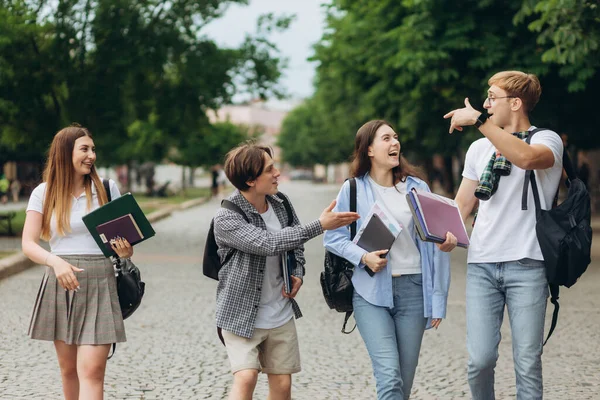 Group of teenage students standing outdoors