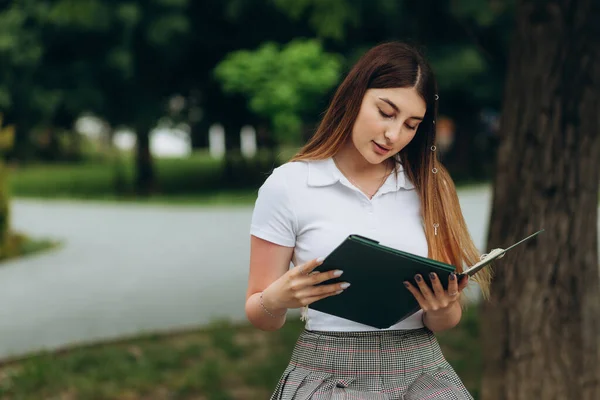 Student girl studying in the park