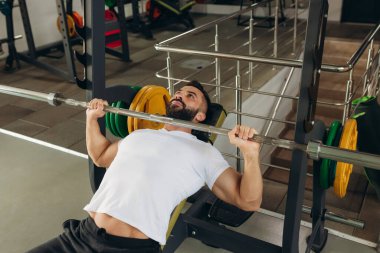 Young man doing bench press exercise