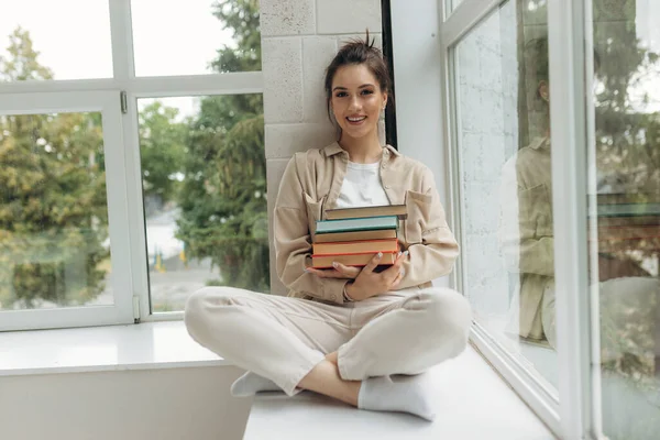 Beautiful Happy Young Woman Sitting Windowsill Book Her Hands — Foto de Stock