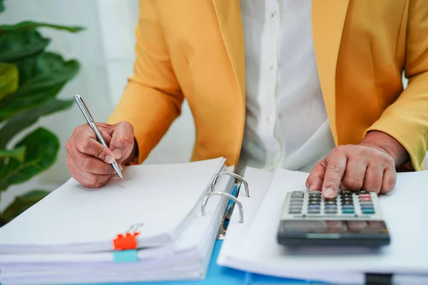 Business woman busy working with documents in office.