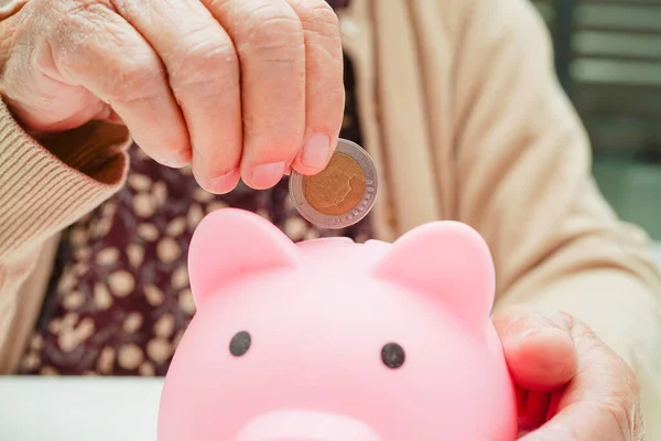Retired Elderly Woman Putting Coins Money Piggy Bank Worry Monthly — Stockfoto