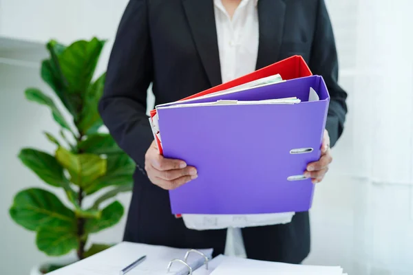 Business woman busy working with documents in office.