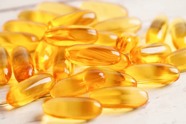 Fish oil or Cod liver oil gel in capsules with omega 3 vitamins, supplementary healthy food