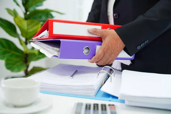 Business woman busy working with documents in office.