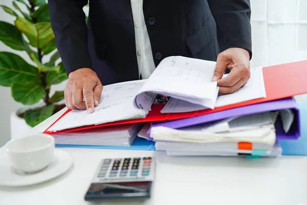 Business woman busy working with documents in office.