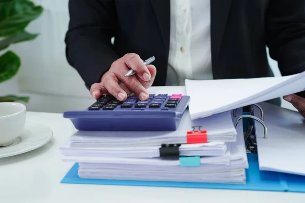 Business woman busy working with documents in office.