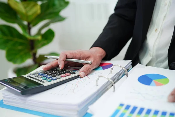 Business woman busy working with documents in office.