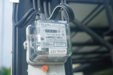 Bangkok, Thailand - May 15, 2022 Electric measuring power meter for energy cost at home and office.