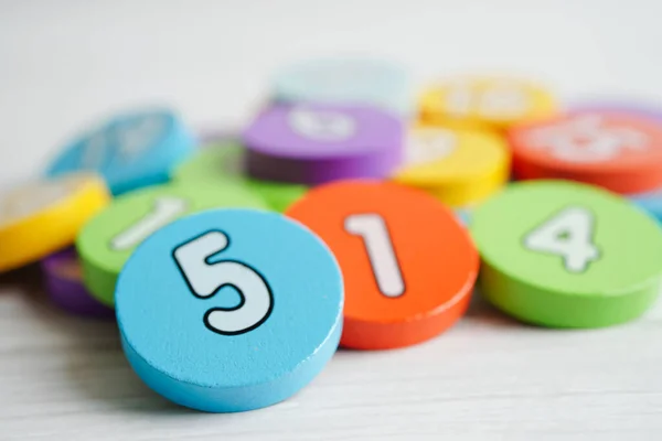 Number wood block cubes for learning Mathematic, education math concept.