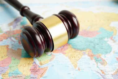 Bangkok, Thailand - May 15, 2022 Judges gavel on world map.