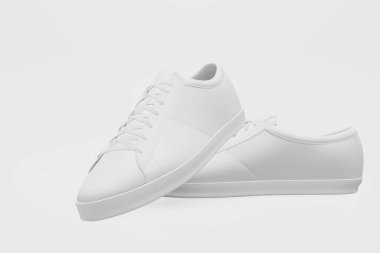 Beyaz arka planda beyaz ayakkabılar. Minimum konsept fikir. 3B görüntüleme.