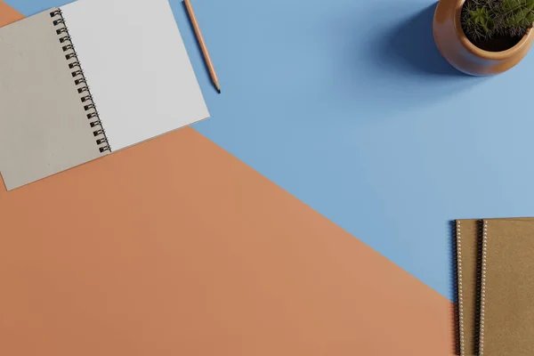 Mavi ve turuncu arka plandaki çalışma masasının bir kopyası. Üst görünüm düzlüğü kopyalama alanı ile yatıyordu.