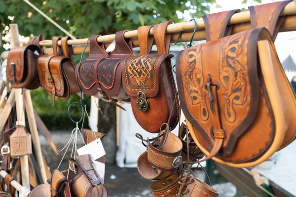 Street trade in original leather goods. Germany, Burgstein, medieval festival. High quality photo