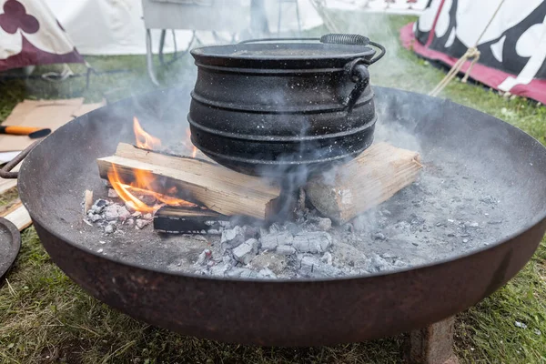 Cooking food on a campfire in a medieval festival in Germany, Burgstein. High quality photo