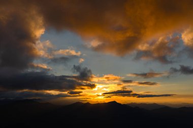 Wonderful bright summer sunset in the Astrian Alps in orange hues, from a height of 2400 meters. High quality photo