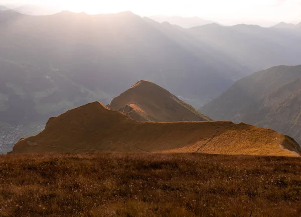 Indian summer and red slopes in the Alpine mountains. Gasteinertal, Austria. High quality photo