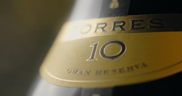 WARSAW, POLAND - SEPTEMBER 12, 2021: close up shot of the bottle of Torres brandy that is spinning around, Torres advertisement footage, 4k 60p Prores HQ — Stock Video