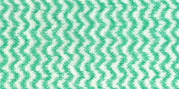 High detail large image magnified close up of an uncoated tissue paper texture background scan with green and white wave ornament and rough fiber grain napkin high resolution wallpaper