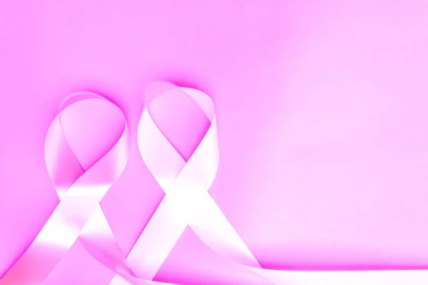 Breast cancer awareness ribbon, pink ribbon, white ribbon, fight against violence against women, international cancer day concept.