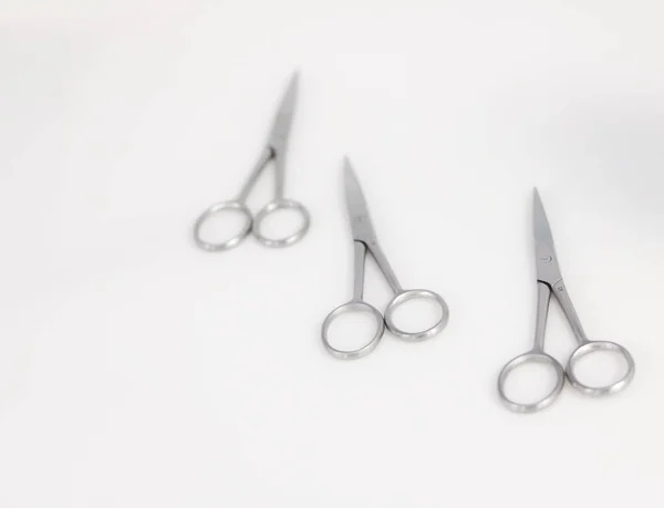 Three Surgical Scissors Placed White Surface — стоковое фото