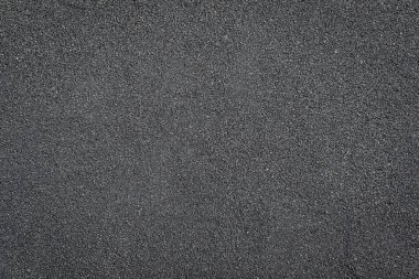 Arkaplan kum taneleri, güzel siyah kumsal kumları. Metin için konum.