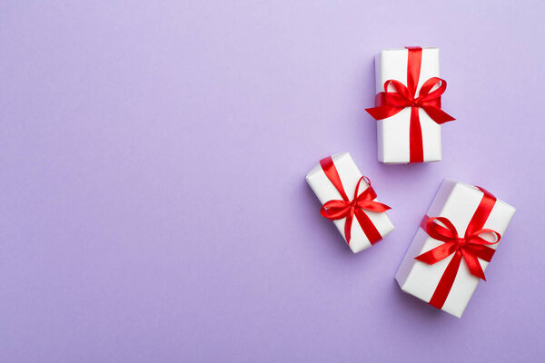 Top view of gift boxes on color background.