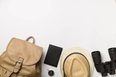 Travel accessories for mountain trip on white background, top view.