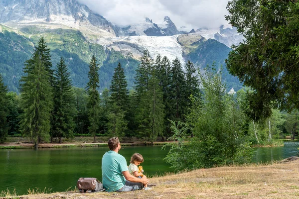 Father His Little Daughter Sitting Lake Shore Looking Mont Blanc — Stockfoto