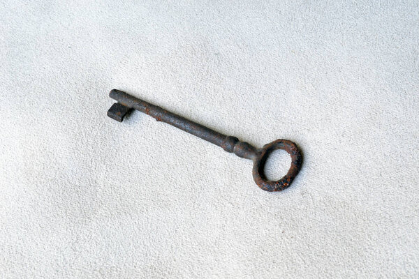 Vintage rusty key made of metal