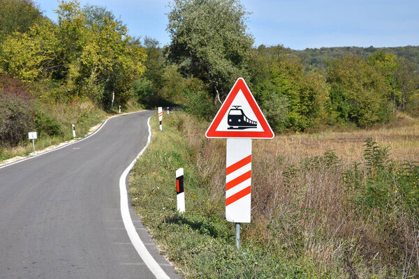 Road sign that warns drivers on upcoming rail road crossing