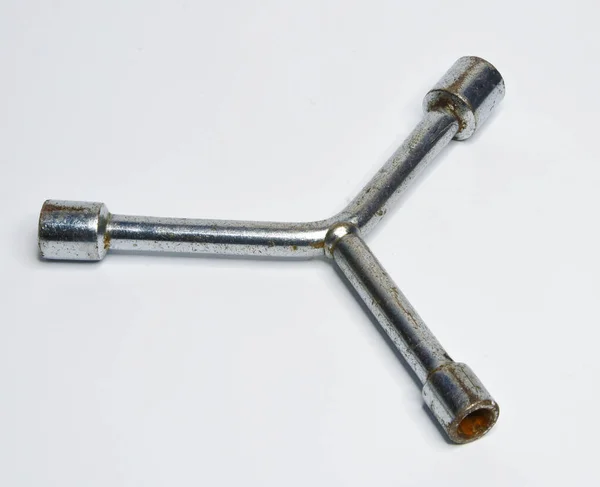 拧开螺钉用的三个金属腿工具 — 图库照片