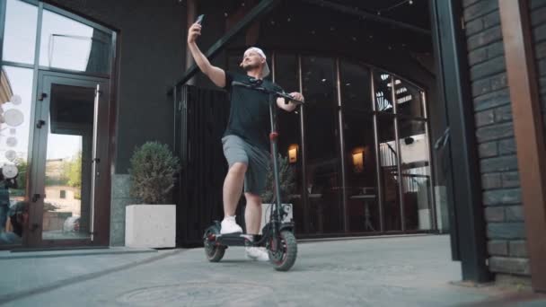 Young Man Standing Scooter City Downtown Taking Selfie Smartphone — Stok video