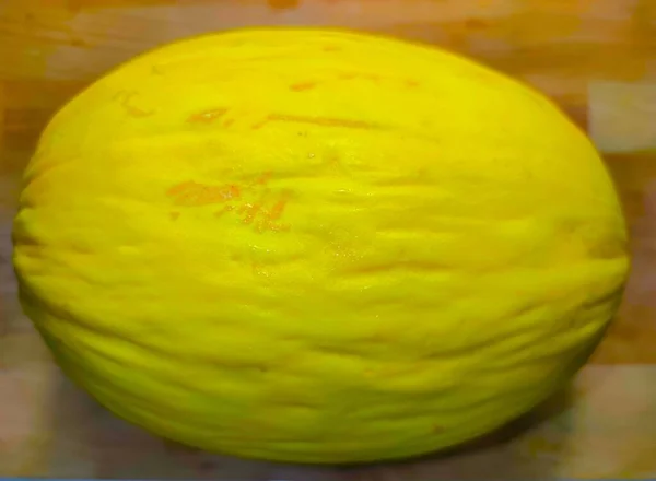 Melon jaune sur fond en bois