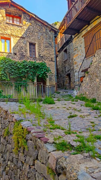 old stone house in a small village in a summer day