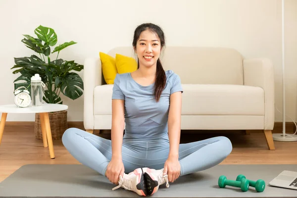 Healthy lifestyle young woman fitness gym for body slim. Young people girl exercise at living room on line. Fitness instructor exercising the fitness. Diet and Healthy sport Concept