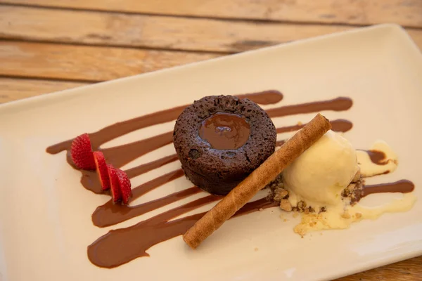 Delicious coulant or chocolate volcano with vanilla ice cream an