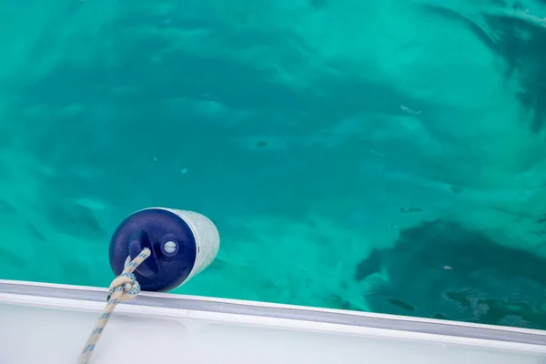 Boat defense on the turquoise and crystalline waters of Alicante