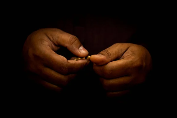 Muslim man hand for praying ,isolated on Dark Background.concept for Ramadan, Eid al Fitr, eid ad-ha, meditation, islamic praying