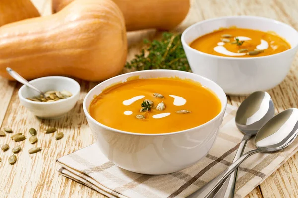 Delicious Pumpkin Soup Bowl Cream Sauce White Wooden Table Selective — Stockfoto