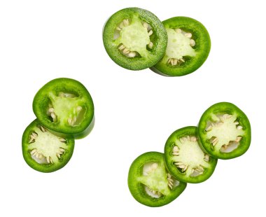 green jalapeno chili pepper cut in pieces  isolated on white background top view.