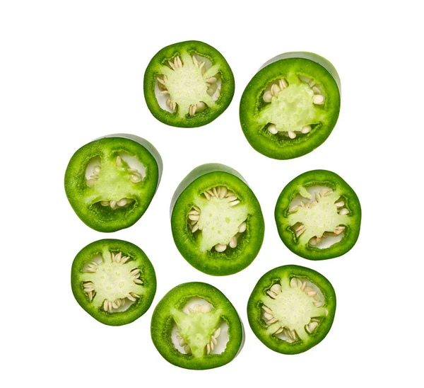 green jalapeno chili pepper cut in pieces  isolated on white background top view.
