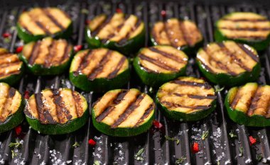 Delicious sliced grilled zucchini.Healthy summer veggie food. Fried zucchini slices.