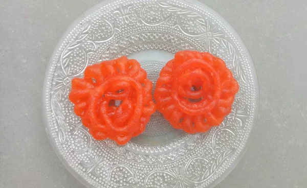 Hint tatlı gıda ımarti de bildiğiniz gibi ozi, Omriti, Jahangir, Jalebi, Jaangiri. Bu dairesel çiçek şekli bir tür derin kızartma Vigna Mungo un meyilli tarafından yapılmıştır.