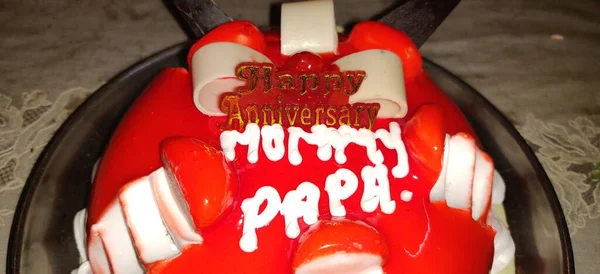 Mom Dad Anniversary Celebration Cake. Anniversary celebration of mummy, papa or mom and dad . Anniversary strawberry cake.